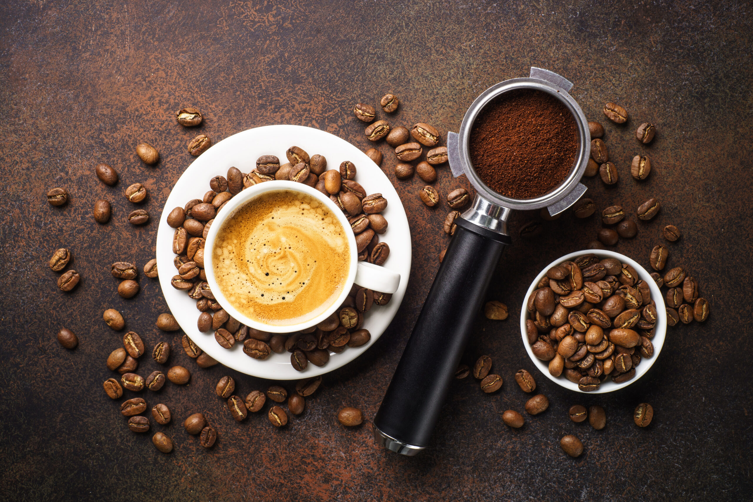 cup of coffee, filter, and beans, illustrating coffee recipes