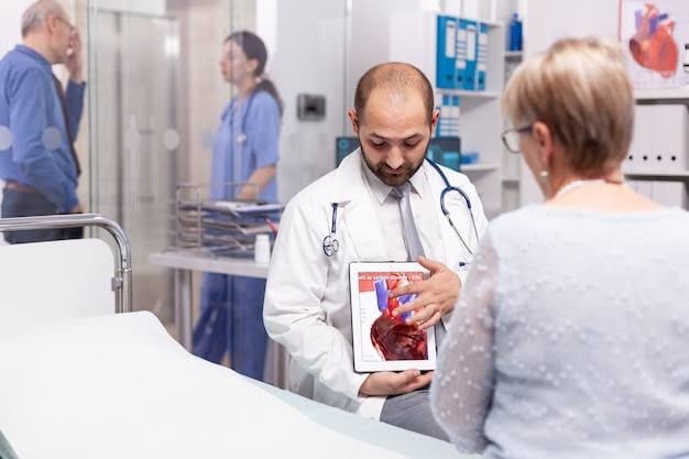 A doctor explaining heart disease using a tablet to a patient sitting on the hospital bed- Can Coffee Reduce Inflammation?