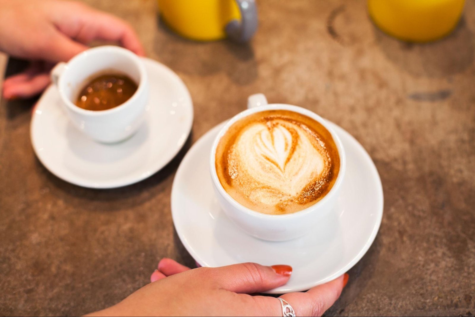 woman holding cup of coffee
