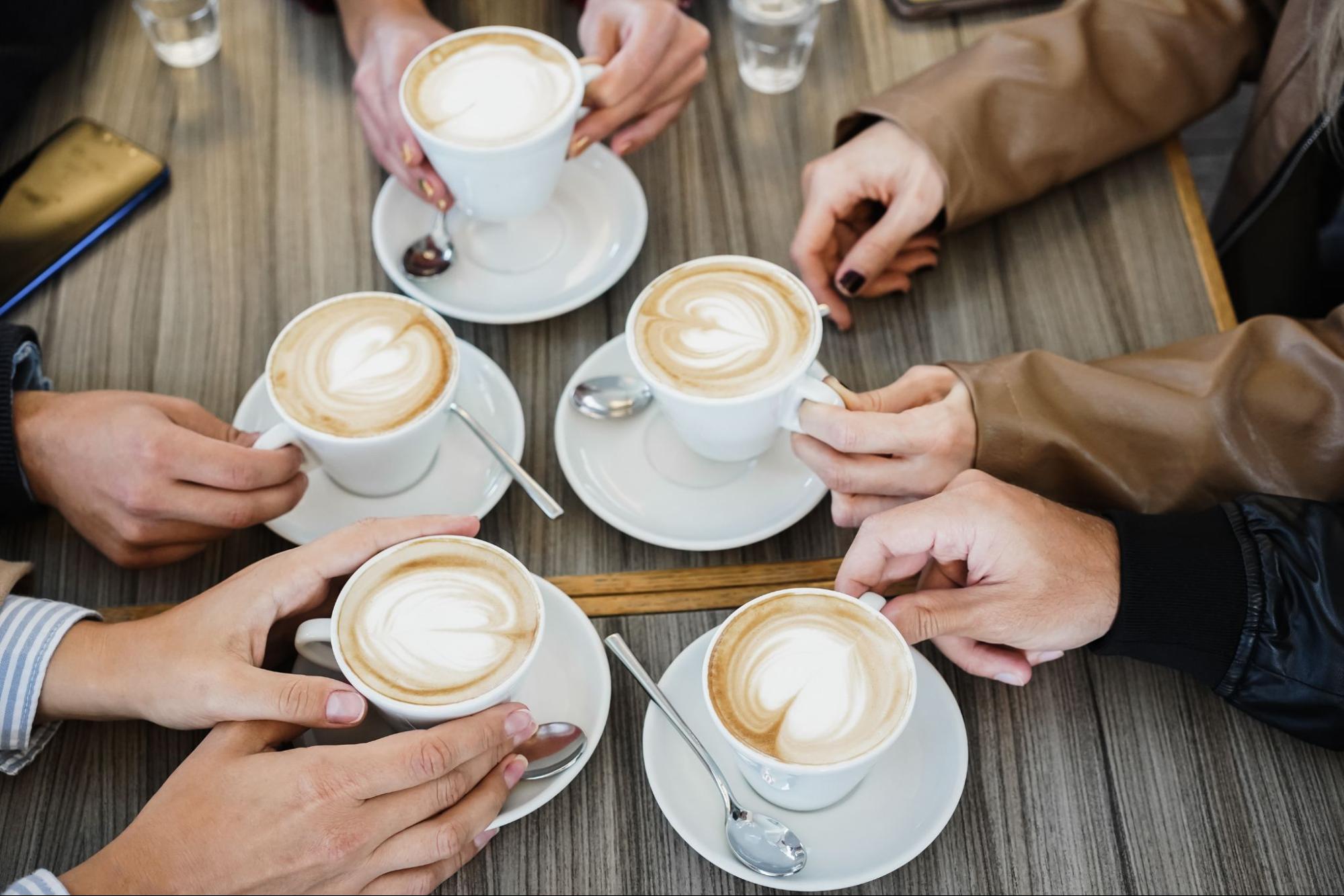 people enjoying cups of coffee