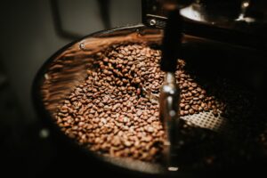 Coffee beans tumbling in a roasting machine